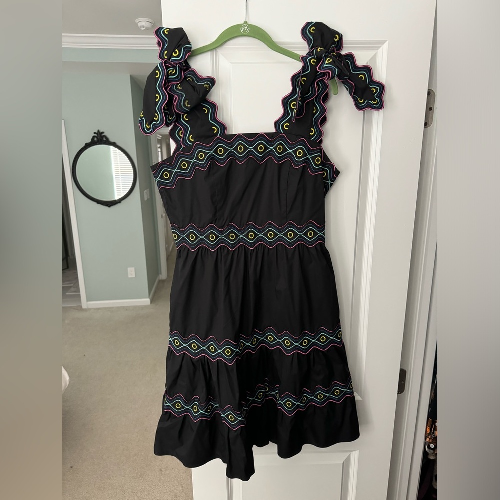 CeliaB black dress with bright colored accents and bow straps.